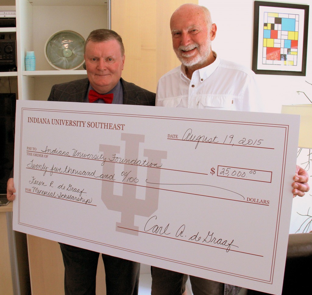Former IU Southeast professor of educational psychology Carl deGraaf presents a check to Chancellor Ray Wallace for the Karen R. deGraaf Memorial Scholarship.