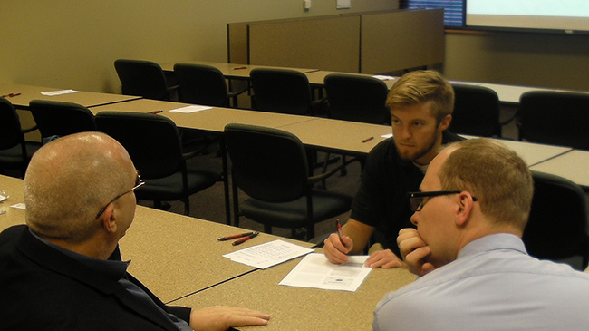 Bryson Mills discusses HR with local professionals.