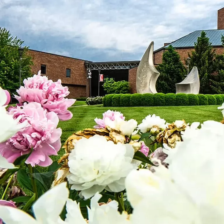 The Ogle Center at IU Southeast in the spring, surrounded by flowers.