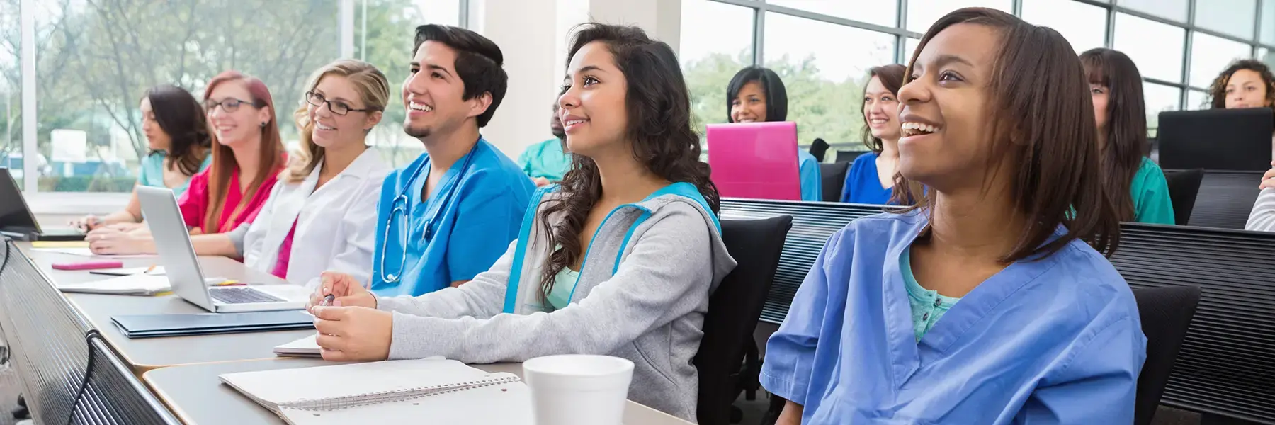 Classroom of graduate nursing students sitting at desks