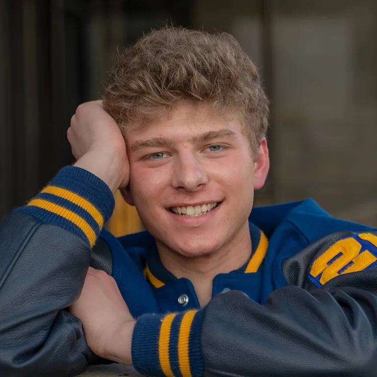 IU Southeast Honors Program student Andrew James Roy smiling and posing