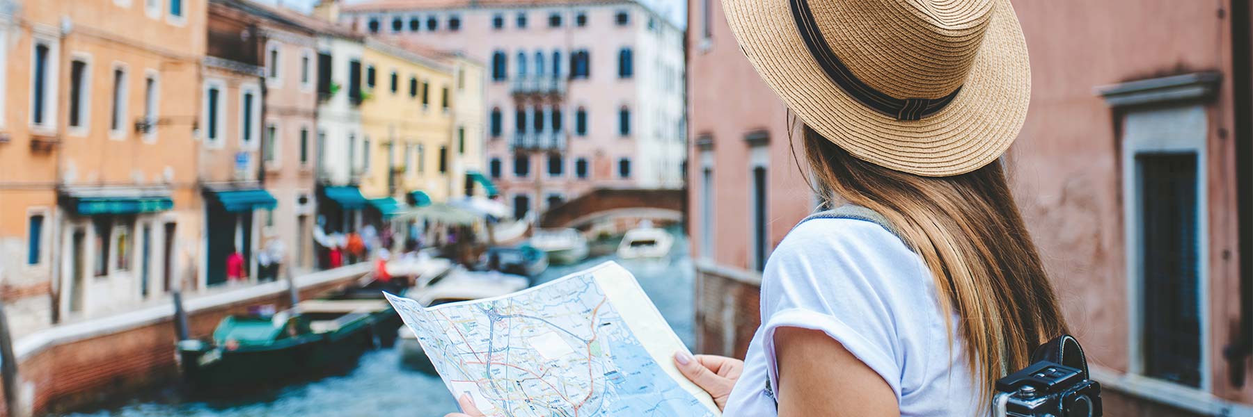 Student looking at a map on a trip abroad