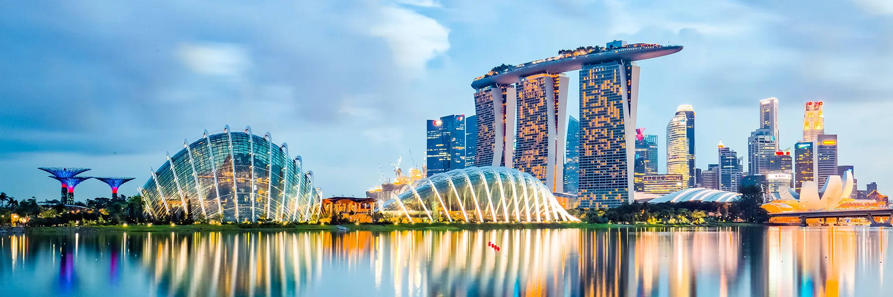 Singapore skyline reflected in the water on a cloudy day