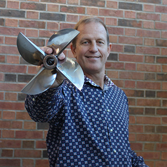 Paul Pittman holding propeller