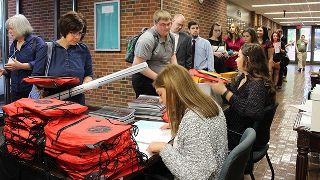 Students line up to register for the conference.