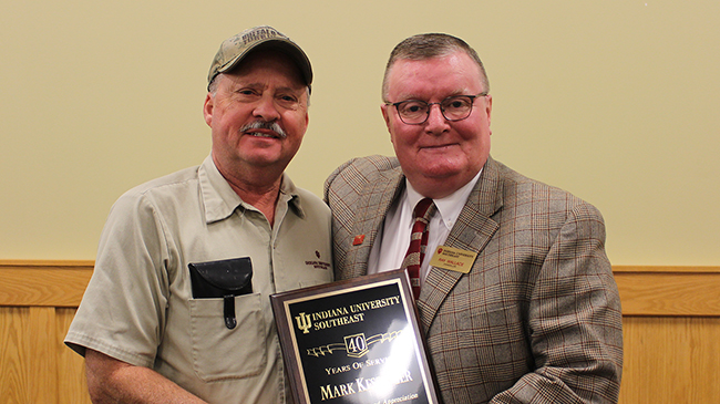 Mark Kessinger, grounds service staff, with Chancellor Wallace. Kessinger has served for 40 years.