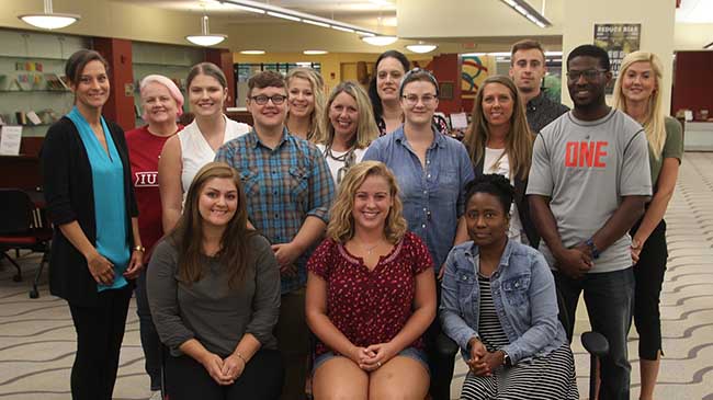 Kim LaFollette (l) with graduate students enrolled in the Master of Science in Mental Health Counseling program.