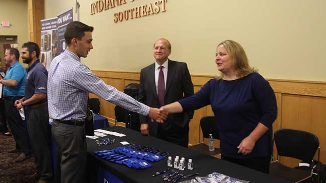 Students and employers shake hands at the annual Accounting and Finance Career Day.
