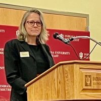 Interim Chancellor, Dr. Kelly Ryan speaks from a podium in the Hoosier Room for the annual State of the Campus Address