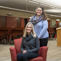 Professors Steffany Maher and Rebekah Dement pose at the IU Southeast library