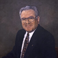 Photo of portrait painting of Dr. Leon Rand, chancellor of IU Southeast 1986-1996