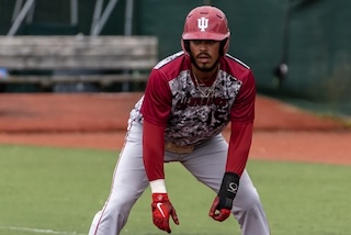 Former IU Southeast baseball player is in uniform and waiting on base.