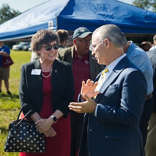 IU Southeast Chancellor Debbie Ford speaks with Bill White of the Indiana Members Credit Union and IU Southeast Board of Advisors at the Novaparke Grand Opening Ribbon Cutting Ceremony on July 11, 2023.